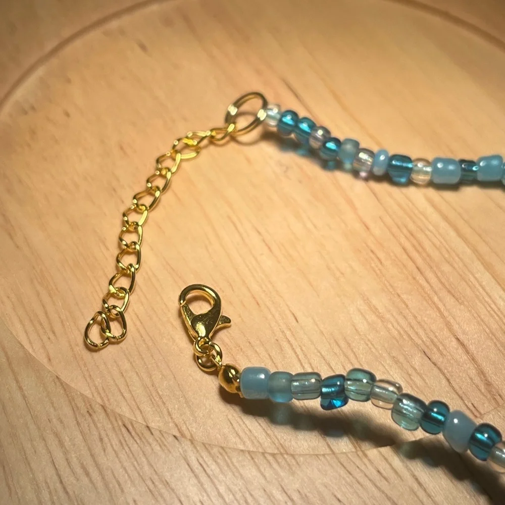 Handmade pack of matching blue beaded bracelets beach theme gold turtle starfish